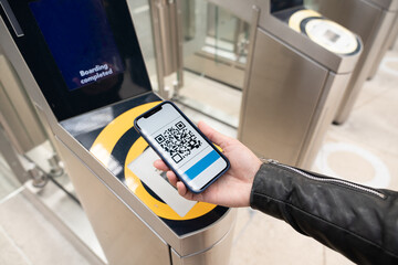 Holding Phone With QR Code On Screen