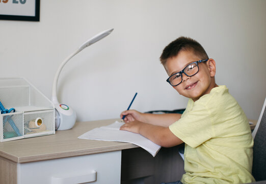 Boy Doing Homework in his Room