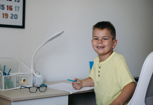 Boy Doing Homework in his Room