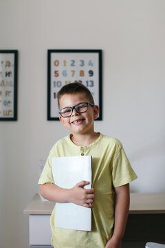 Boy Doing Homework in his Room