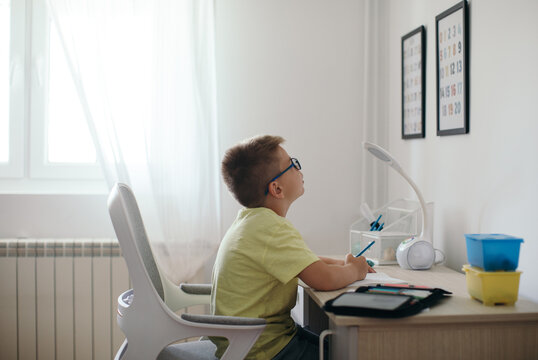 Boy Doing Homework in his Room