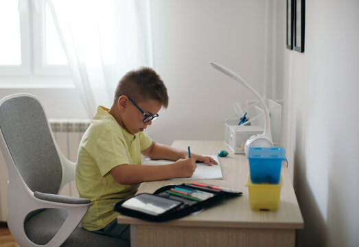 Boy Doing Homework in his Room