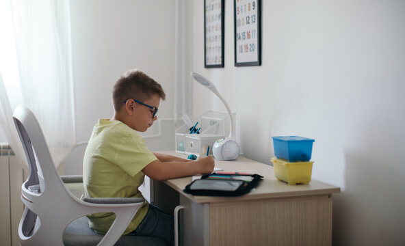 Boy Doing Homework in his Room
