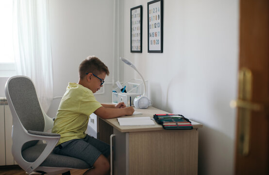 Boy Doing Homework in his Room