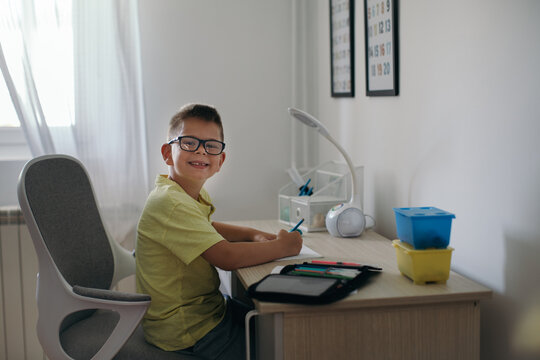 Boy Doing Homework in his Room
