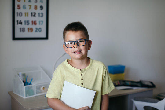 Boy Doing Homework in his Room