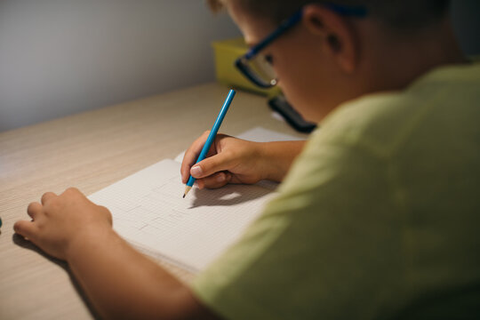 Boy Doing Homework in his Room
