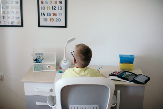 Boy Doing Homework in his Room