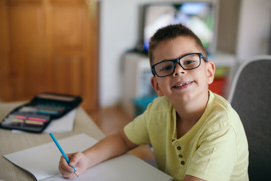 Boy Doing Homework in his Room