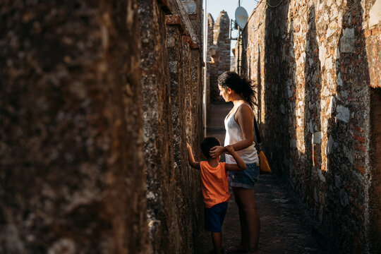 Hispanic mother and child on street