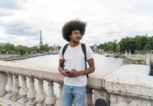 Man Holding Cellphone In Paris