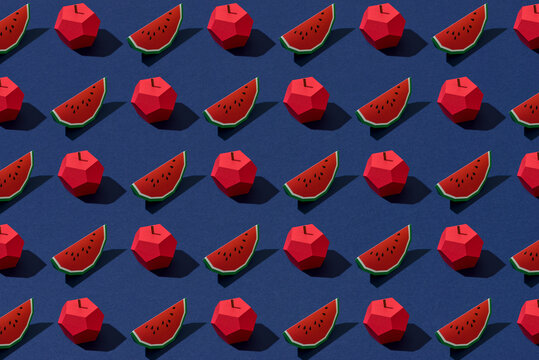 top view of handmade colorful origami fruits on blue