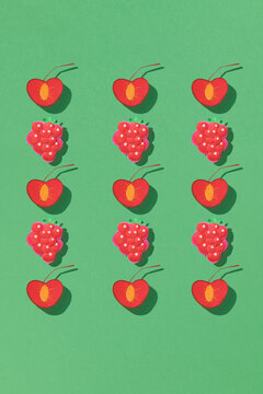 paper cut craft style fresh cherrys and berries.