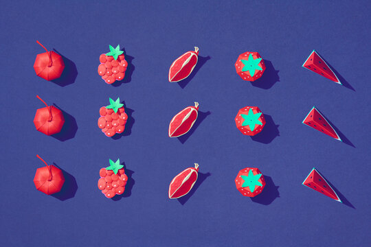Paper with cherry, watermelon, raspberries, and pomegranates