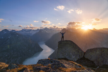 Man standing on rock in the alps.