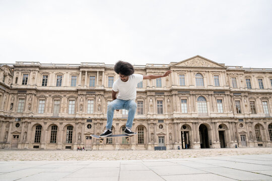 Performing Trick With Skateboard At Square