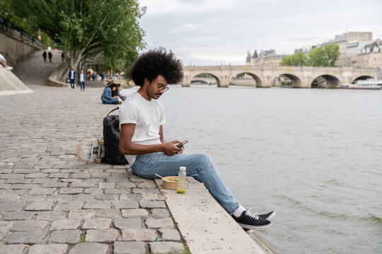 Young Man Having Lunch Outdoors