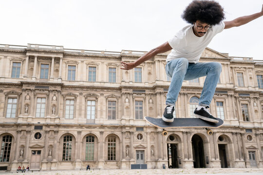 Man Performing Trick With Skateboard
