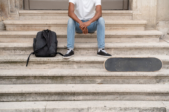 Anonymous Skater Sitting On The Stairs