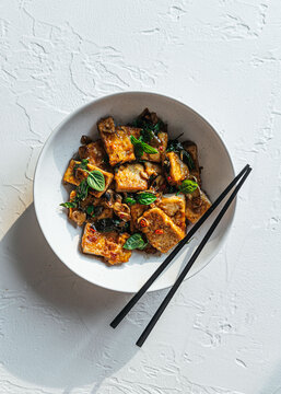 Vegan tofu stir fry in ceramic bowl