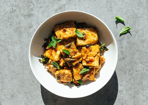 Vegan tofu stir fry in ceramic bowl