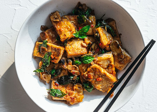 Vegan tofu stir fry in ceramic bowl