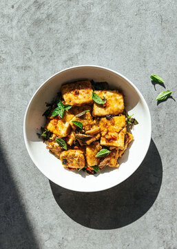 Vegan tofu stir fry in ceramic bowl