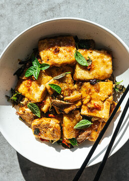 Vegan tofu stir fry in ceramic bowl