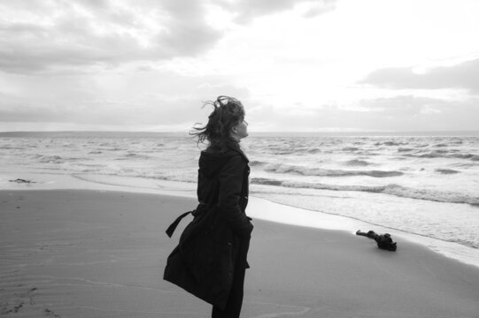 woman watching at the sea on a windy day