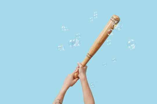 Woman breaking soap bubbles