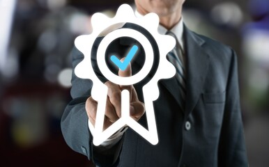 Hand shows the sign of the top service Quality assurance, Standards,