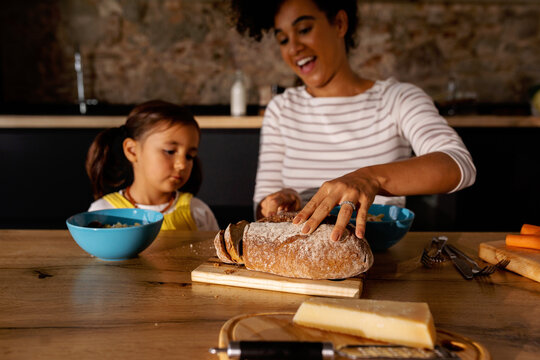 Mother and daughter lunchtime in kitchen