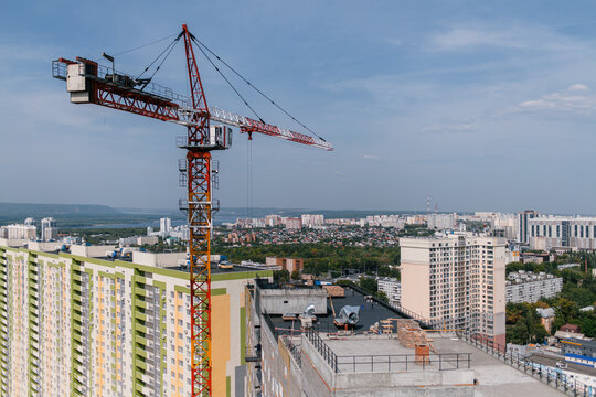 Cranes on construction site in city
