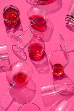 Different glasses with bright red drinks