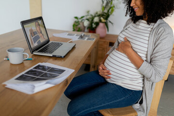 Prenatal woman doing video call with her gynecologist
