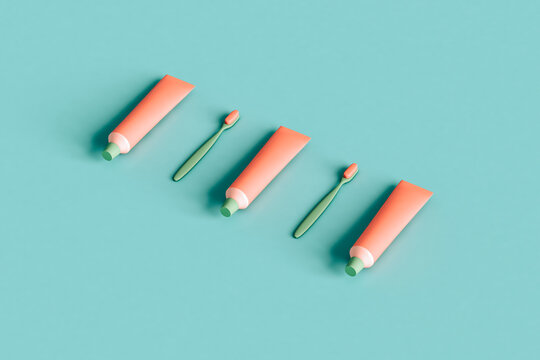 toothbrush and toothpaste organized on blue