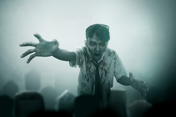 Scary zombie with blood and wound on his body walking