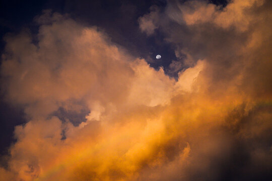 The moon, rainbow and storm