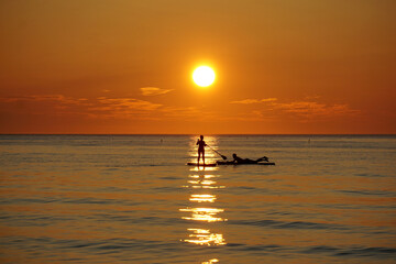 Surf couple at sunset