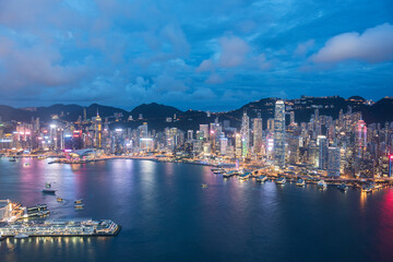 Aerial view of Victoria Harbor of Hong Kong City at dusk