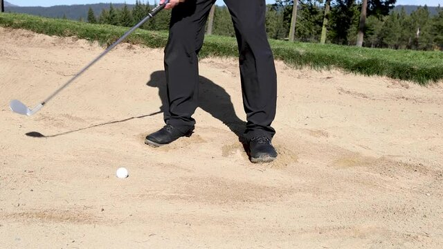 golfer hitting a bunker shot in slow motion shot at 120fps
