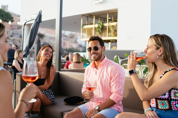 Company of friendly people on terrace