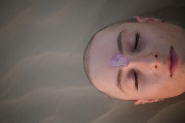 Woman with a crystal on top of her head