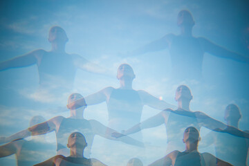 Multiple exposure of a woman with open arms 