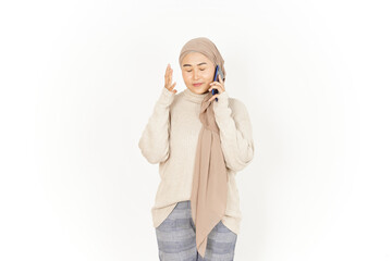 Talking on the Phone with Angry Expression of Beautiful Asian Woman Wearing Hijab Isolated On White Background