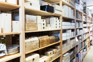 Fototapeta premium Supermarket of household goods - wooden original caskets on shelves store