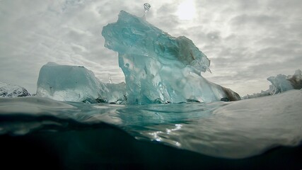 Iceberg sculpture at water level, Arctic Greenland spring melt