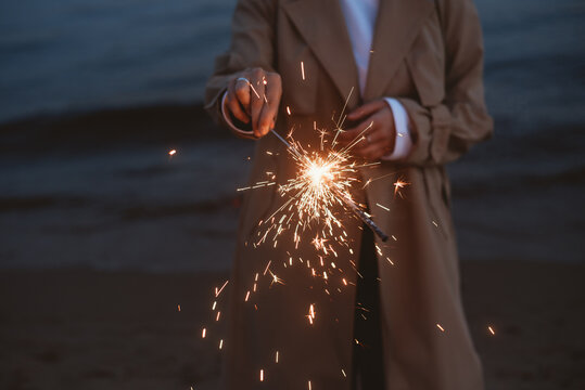 Woman holding a sparkle