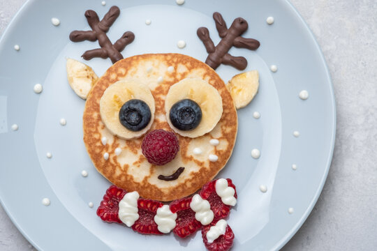 Funny food for kids. Reindeer pancake for  breakfast
