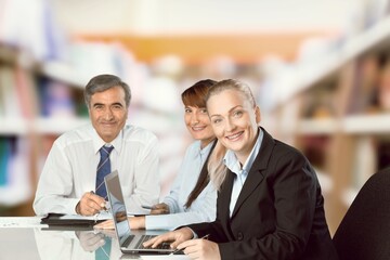 Professional lawyer financial advisor consulting happy family couple clients in modern office.